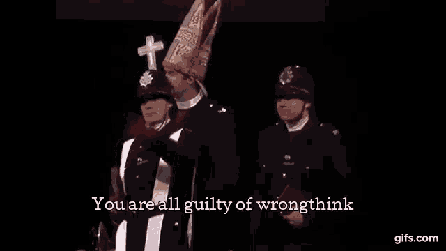 a man in a bishop 's hat is standing next to a group of police officers in uniform .