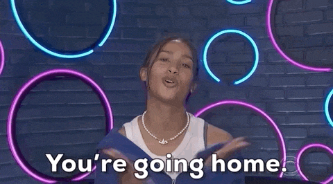 a woman is saying `` you 're going home '' in front of a brick wall with neon lights .