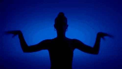 a woman 's silhouette is against a blue background