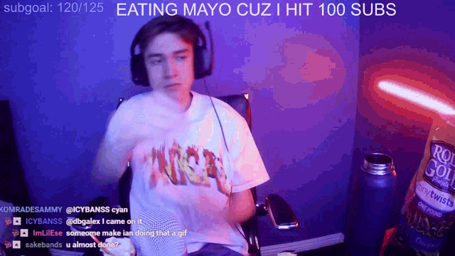 a person wearing headphones and a shirt that says ' eating mayo cuz i hit 100 subs ' on it