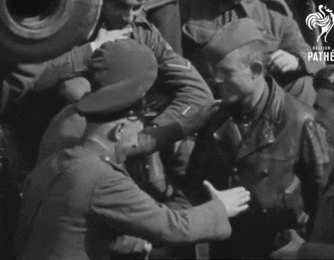 a black and white photo of soldiers with the pathe logo