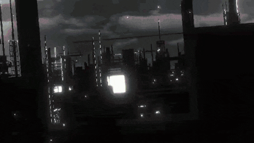a computer generated image of a city at night with a lot of buildings and lights .
