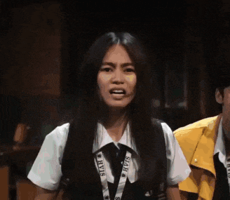 a woman wearing a lanyard that says ' siam ' on it