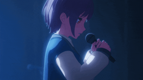 a girl singing into a microphone with a blue background