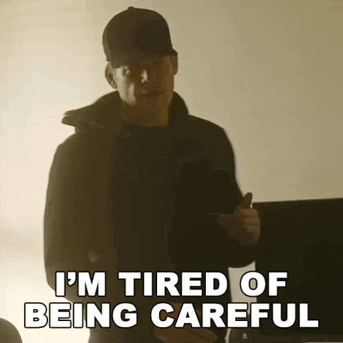 a man in a black jacket and hat says " i 'm tired of being careful "
