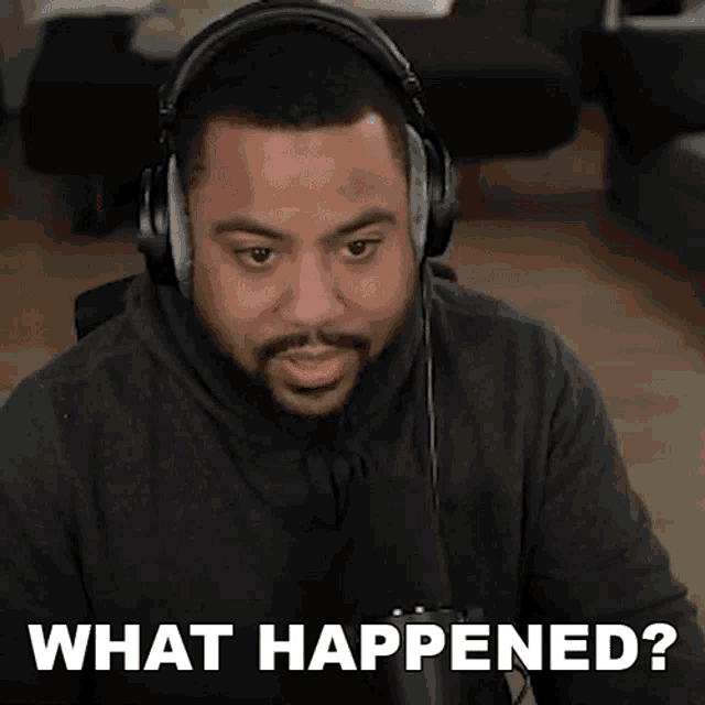 a man wearing headphones and a microphone says what happened