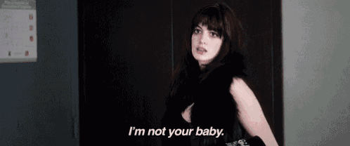 a woman is standing in an elevator and says `` i 'm not your baby . ''