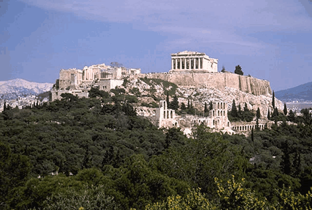 the acropolis in athens is surrounded by trees and mountains