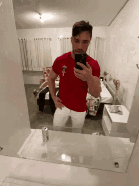a man taking a picture of himself in a mirror