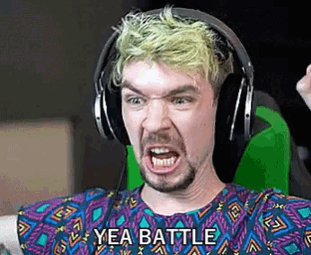 a man wearing headphones is making a funny face and says yea battle