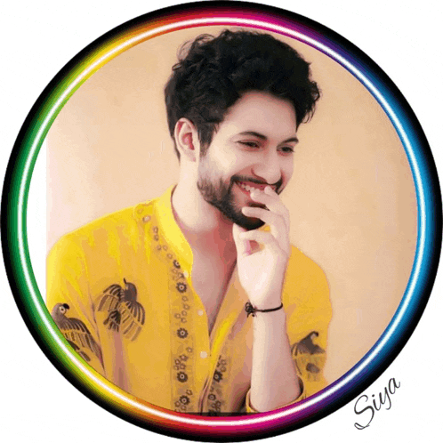 a picture of a man in a yellow shirt is surrounded by a rainbow colored circle with the name siya written on it
