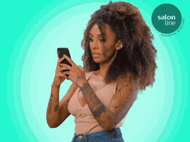 a woman is looking at her phone with a salon line logo in the background