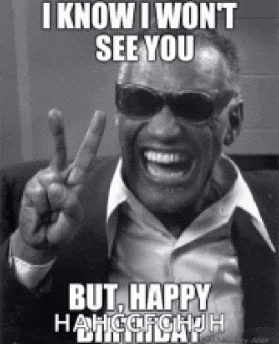 a black and white photo of a man wearing sunglasses and a suit giving a peace sign