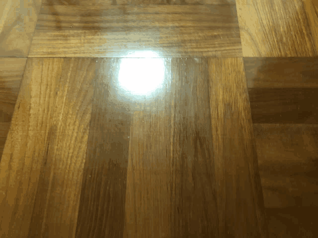 a light shines on a wooden floor