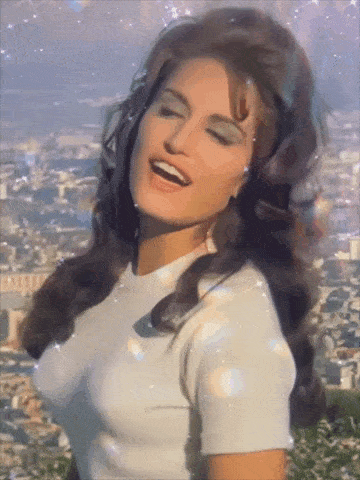 a woman in a white shirt with her eyes closed