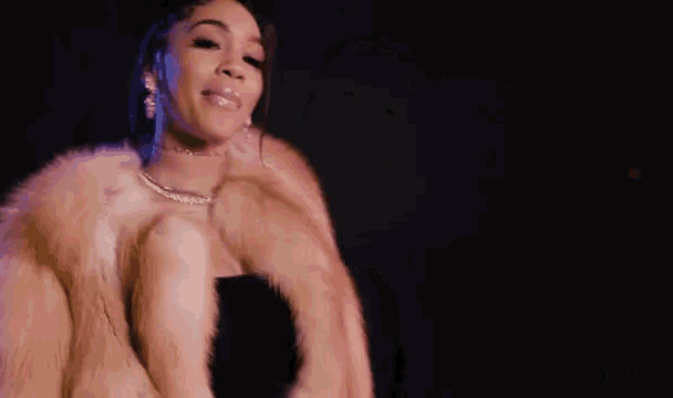 a woman is giving the middle finger to a man while dancing .