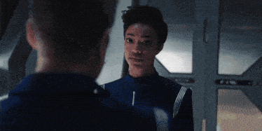 a man and a woman are standing next to each other