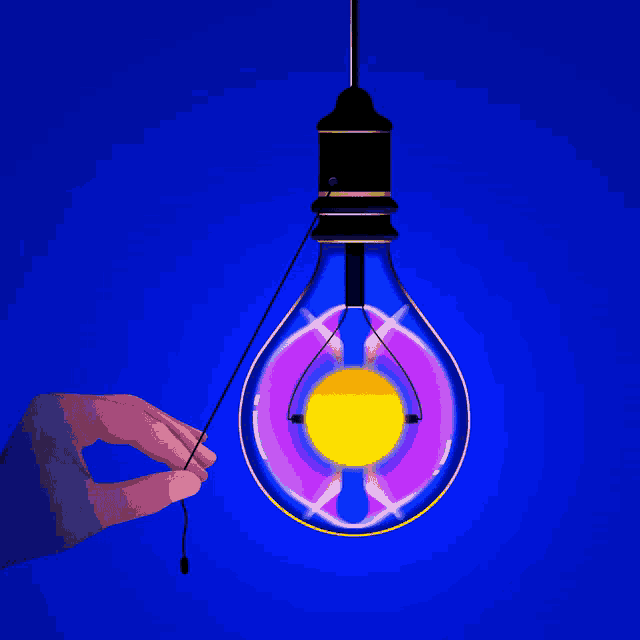 a hand is holding a light bulb with a yellow and purple light inside of it