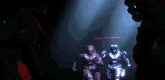a couple of soldiers are dancing in a dark room .