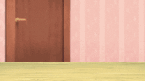 a wooden table with a door in the background and a pink wall behind it .