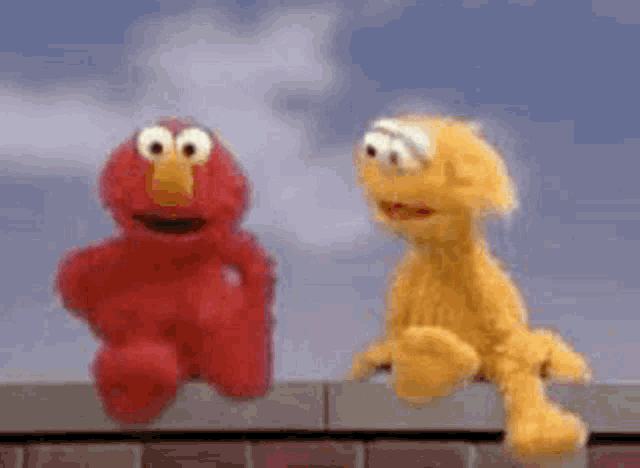 Lol Elmo GIF - Lol Elmo Shrug GIFs
