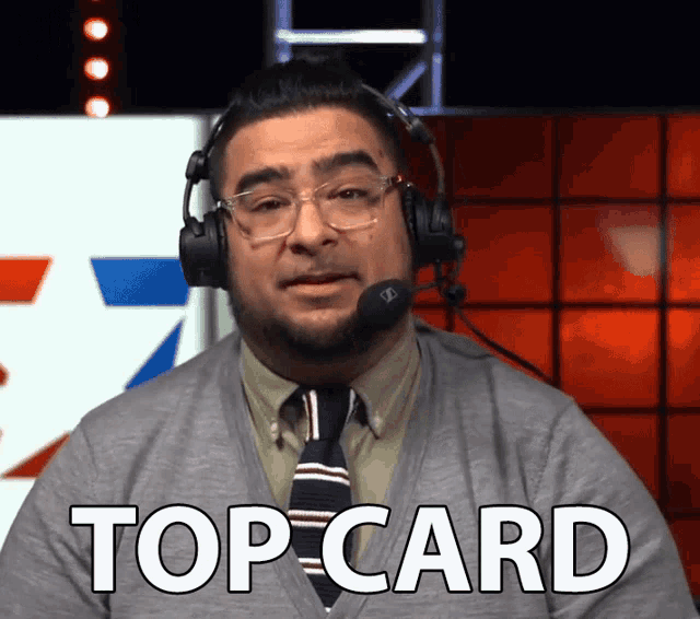a man wearing headphones says top card