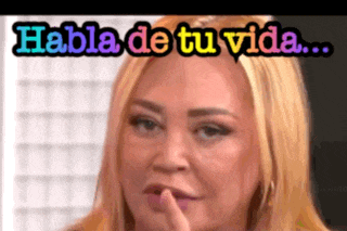 a woman covering her mouth with her finger and the words habla de tu vida written above her