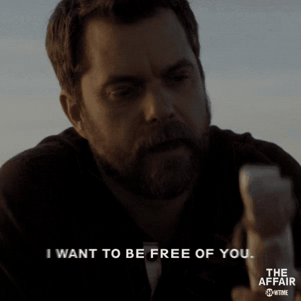 a man with a beard is holding a piece of paper and says i want to be free of you