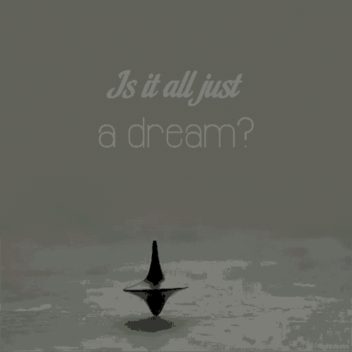 a spinning top with the words " is it all just a dream " on it