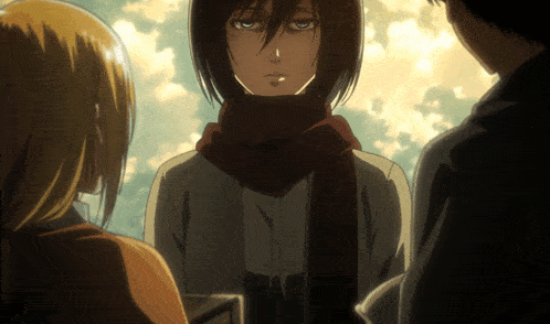 a woman with a scarf around her neck stands between two other women