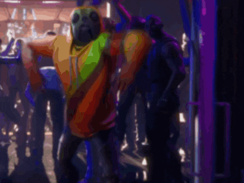 a man in a deadpool costume stands in a crowd of people