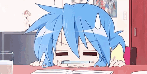 a blue haired anime girl is sitting at a table with a pencil in her mouth .