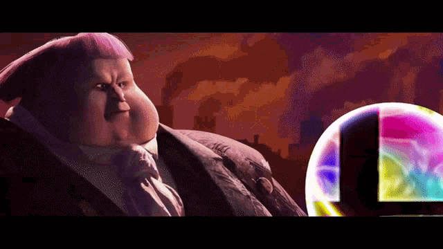 a fat man in a suit and tie stands in front of a rainbow colored sphere
