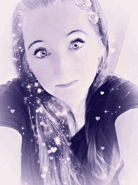 a close up of a woman 's face with hearts and stars coming out of her hair