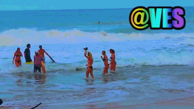 a group of people are standing in the water with the words @ves above them