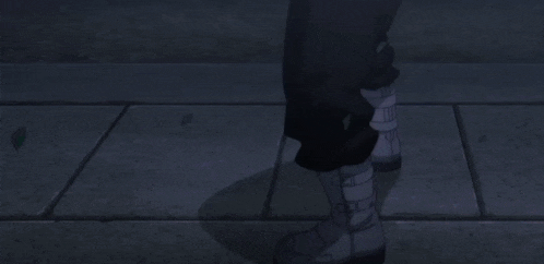 a man and a woman are standing next to each other in a dark park at night .