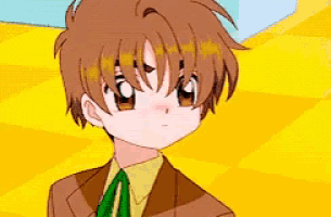 a close up of a boy in a suit and tie .