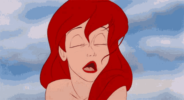 a close up of a cartoon character with red hair and blue eyes making a surprised face .