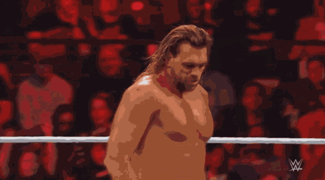 a man in a wrestling ring with the words too easy written below him