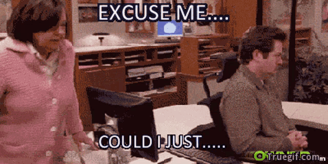 a man sitting at a desk with the words excuse me could i just written above him
