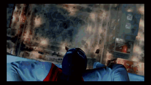 a man in a superhero costume is laying on a couch