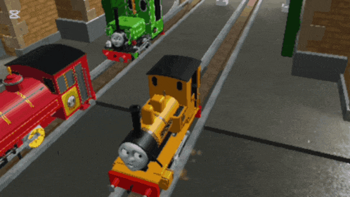 a yellow train with the word thomas on it