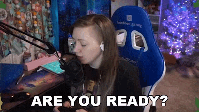 a woman sitting in a facebook gaming chair is asking if she is ready
