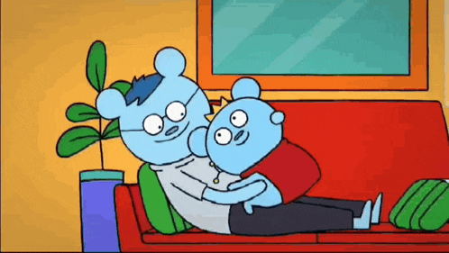 a couple of blue bears are laying on a red couch hugging each other .