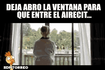 a woman in a bathrobe is looking out a window with the caption deja abro la ventana para que entre el airecit .