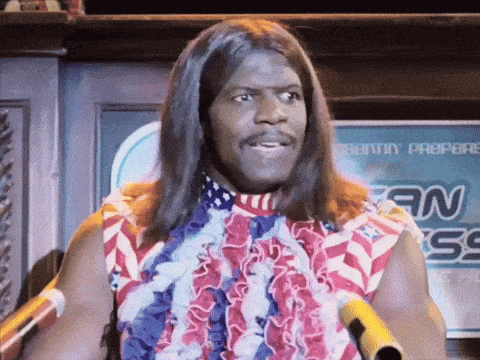 a man with long hair is standing in front of a sign that says sonny propere