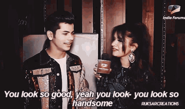 a man and a woman are standing next to each other and the woman is saying " you look so good "