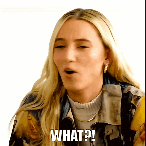 a blonde woman with a surprised look on her face says " what "
