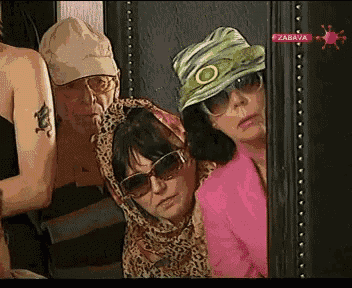 a group of people wearing sunglasses and hats are standing in front of a tv screen with zabava on it