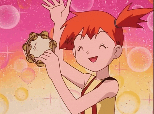 a girl with red hair holds a tambourine in her hand